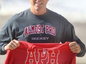 Ron Chagnon operates a silk screening and embroidery business in Kenora, he is wearing and holding a few of his products from his up-and-coming line Almost Pro Hockey.  Tuesday, March 25, 2014.