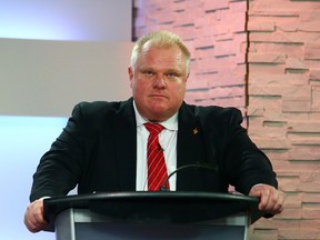 Mayor Rob Ford listens to closing remarks during the first TV debate at CITY-TV on March 26, 2014. (Dave Abel/Toronto Sun)