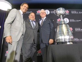 From the left - Manitoba Premier, Greg Selinger, President and CEO of the Winnipeg Blue Bombers, Wade Miller, and Commissioner of the Canadian Football League, Mark Cohon.  It was announced that Winnipeg would host the Grey Cup in 2015.  Wednesday, March 26, 2014.