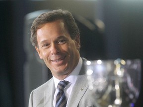 Commissioner of the Canadian Football League, Mark Cohon applauds after announcing that Winnipeg would host the Grey Cup in 2015 on Wednesday, March 26, 2014. (Chris Procaylo/Winnipeg Sun)