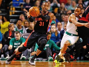 Raptors’ Terrence Ross takes a pass in front of Avery Bradley of the Celtics on Wednesday night in Boston. Ross was the Raps’ leading scorer with 24 points, including a clinching three. (Jared Wickerham, AFP)