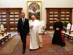 U.S. President Barack Obama walks with Pope Francis during their meeting at the Vatican March 27, 2014.  REUTERS/Kevin Lamarque