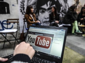 A person uses a laptop computer showing YouTube's logo on March 27, 2014 in Istanbul. (AFP PHOTO/OZAN KOSE)