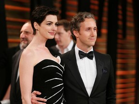 Actress Anne Hathaway and her husband Adam Shulman arrive at the 2014 Vanity Fair Oscars Party in West Hollywood, California March 2, 2014. (REUTERS/Danny Moloshok)