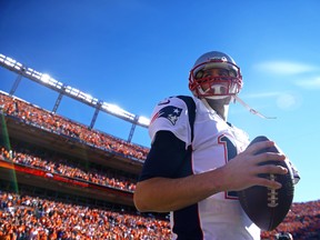 New England Patriots quarterback Tom Brady (12) prior to the game against the Denver Broncos in the second half of the 2013 AFC Championship football game at Sports Authority Field at Mile High on January 19, 2014 in Denver, CO, USA. (Mark J. Rebilas/USA TODAY Sports)