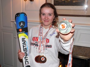Fourteen-year-old skiing sensation Gillian Mikalachki shows off some of her hard earned hardware.