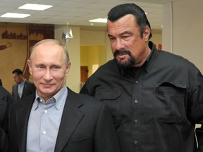 Russia's President Vladimir Putin and American action movie actor Steven Seagal visit a newly-built sports complex of Sambo-70 prominent wrestling school in Moscow. (AFP PHOTO/ RIA-NOVOSTI/ POOL / ALEXEI NIKOLSKY)