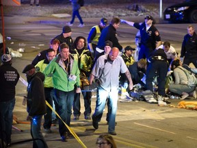 A victim who was struck by a vehicle on Red River Street during the SXSW festival is carried away in downtown Austin,Texas March 13, 2014. (REUTERS/Jay Janner/American-Statesman/Handout via Reuters)