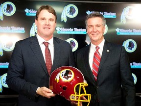 Washington Redskins head coach Jay Gruden speaks as general manager Bruce Allen looks on during a press conferences at Redskins Park Team Auditorium earlier this year. (Brad Mills-USA TODAY Sports)