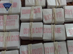 Bags of heroin labelled "Obamacare" are pictured in this Dec. 20, 2013 photo from Massachusetts State Police. (Handout/QMI Agency)