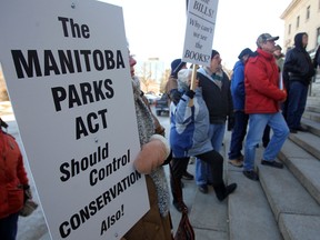A group of individuals protested service and lease fee increases for cottage owners Thursday at the Manitoba Legislative Building. (CHRIS PROCAYLO/WINNIPEG SUN)