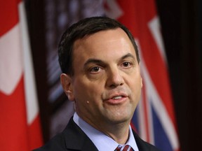 PC leader Tim Hudak addresses media at Queen's Park on Thursday. (MICHAEL PEAKE/Toronto Sun)