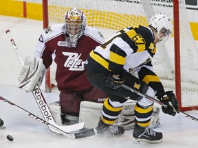 Peterborough Petes goalie Andrew D'Agostini stops Kingston Frontenacs' Lawson Crouse during Game 4 of an Eastern Conference quarter-final series on Thursday night at the Memorial Centre in Peterborough. (Clifford Skarstedt/QMI Agency)