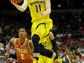 Canadian Nik Stauskas and Michigan will take on Tennesse on Friday night. (USA Today/photo)