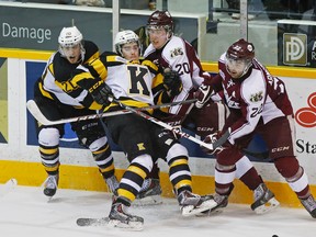Peterborough Petes' Nick Ritchie, right, upends Kingston Frontenacs'  Conor McGlynn during Game 4 Eastern Conference quarterfinal OHL action on Thursday, March 27, Thursday 2014 at the Memorial Centre in Peterborough. Clifford Skarstedt/Peterborough Examiner/QMI Agency