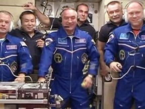 This still image from NASA TV shows Expedition 39, now a six-member crew, talking to family and mission officials moments after entering the International Space Station for the first time on March 27, 2014.     AFP PHOTO / NASA TV
