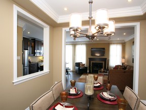 The Primrose II is a model home by Mattamy Homes in Monahan Landing in Kanata. It offers three bedrooms and 1,864 square feet. Its dining room sits under a coffered ceiling and showcases a cut-out which offers a glimpse into the kitchen area.