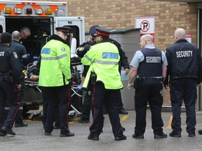 A wounded police officer arrives at Sunnybrook hospital in Toronto after a shooting at a Brampton courthouse Friday. (DAVE THOMAS/Toronto Sun)