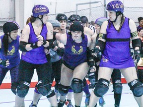 Celeste Thiesen, right, says she loves the rough and tumble of roller derby. Her team played at the TransAlta Tri Leisure Centre in Spruce Grove on March 22. - Kyle Muzyka, Freelance Contributor