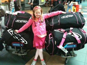 In 2011, Kaelyn Koebernick-Solberg, 6, stood with six hockey bags full of clothing donations destined to reach an orphanage in Laos. Kaelyn is now in Grade 4 and planning her third trip to Asia. In December 2014 she expects to travel with two sea cans full of donated items.
Wanting to be a veterinarian that travels the world caring for all kinds of animals, Kaelyn says her dream job is to work with Veterinarians Without Borders. Clearly her humanitarian days have only just begun. - Photo Supplied