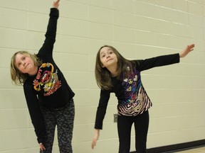 Grade 3 students Avery Brusnyk (left) and Madison Maciocha participate in Wabamun School’s FIT Friday program on March 21. Students enjoy the school’s renovated gymnasium as they engage in this aerobics activity each week. - Karen Haynes, Reporter/Examiner