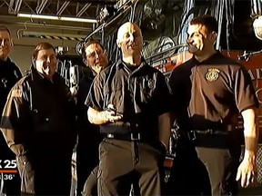 A group of Massachusetts firefighters who sung Frozen's 'Let it Go' to a 4-year-old and her family stuck in an elevator. (YouTube screengrab)