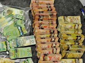 Investigations by the Edmonton Drug and Gang Enforcement Unit (EDGE) resulted in the arrest of 12 individuals in six separate drug trafficking investigations, including one of the highest single seizures of cash in Edmonton Police Service history. The largest of the six busts was effected on Friday, March 21, 2014. EDGE, in conjunction with other specialized EPS units, completed the investigation into a drug distribution network that resulted in the seizure of over $800,000 in cash and 1.5 kg of cocaine with an estimated street value of $85,000. Search warrants were executed at four locations throughout Edmonton, with the majority of cash located in a residence near 167 Avenue and 111 Street. The money was seized under the Victims Restitution and Compensation Payment Act and if successfully restrained will be used to compensate victims of crime and disrupt the business of organized crime. Edmonton Police Hand Out