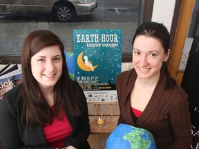 Sustainable Kingston project and outreach coordinator, Katie Wall (left) and her assistant, Marta Reczek, in the Sustainable Kingston offices on Friday. The women are working on the final details for the seventh annual Earth Hour: Kingston Unplugged event in Market Square Saturday evening. 
Julia McKay/Kingston Whig-Standard/QMI Agency