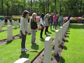 Dutch school kids stand in remembrance at the graves of fallen Canadian soldiers from the Second World War who are buried at the Holten Canadian War Cemetery. A ceremony is held at the cemetery each year.
Mike Strobel/QMI Agency