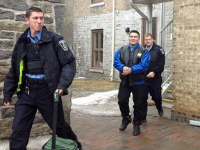 Pierre Aragon is led from Superior Court Friday, March 28, 2014 in Peterborough. Aragon is on trial in relation to the beating of a man during an ongoing biker feud in Peterborough. (SARAH DEETH/PETERBOROUGH EXAMINER/QMI AGENCY)