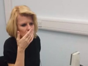 Joanne Milne, 40, as she hears for the first time. (Screen grab)