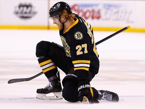 Dougie Hamilton of the Boston Bruins celebrates an assist on his team's goal in the third period against the Montreal Canadiens at TD Garden on March 24, 2014. (Jared Wickerham/Getty Images/AFP)