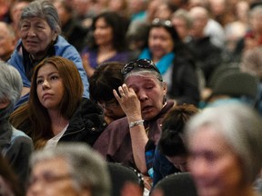Audience members listen to residential school survivor Audrey Desvents speak during the second day of the Truth and Reconciliation Commission of Canada Alberta National Event at the Shaw Conference Centre in Edmonton, Alta., on Friday, March 28, 2014. The the commission hearings run through March 30, 2014. Ian Kucerak/Edmonton Sun/QMI Agency