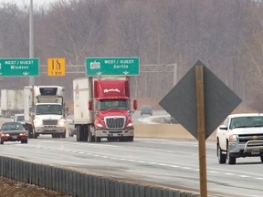 Trucks roll eastward on the Hwy. 401 at the Hwy. 402 intersection where the 402 eastbound ends just west of Wellington Rd. in south London. Mike Hensen/The London Free Press/QMI Agency