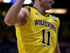 Nik Stauskas of the Michigan Wolverines celebrates after a three-point shot against the Tennessee Volunteers last night at Indianapolis. (AFP)