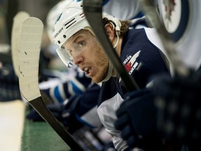 Winnipeg Jets center Bryan Little (18) watches his team take on the Dallas Stars during the third period at the American Airlines Center. (Jerome Miron-USA TODAY Sports)