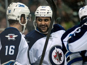 Winnipeg Jets defenseman Dustin Byfuglien (33) celebrates with left wing Andrew Ladd (16) after scoring a goal against the San Jose Sharks during the second period at SAP Center at San Jose. (Ed Szczepanski-USA TODAY Sports)