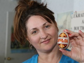 JOHN LAPPA/THE SUDBURY STAR
Marika Babiak shows a Pysanka (Ukrainian Easter egg) that is on display at the Ukrainian Seniors' Centre on Friday. A series of workshops are being held at the Centre in April on how to make a Pysanka. There are workshops for beginners on April 5 and April 12 from 10 a.m. to noon, and there is an advanced workshop on April 12 at 2 p.m. The cost is $20 per person, which includes supplies. For more information, call 705-673-7404.