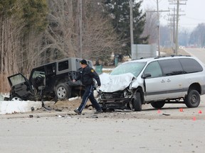 A Jeep travelling south on Carriage Rd. collided with a minivan travelling west on Longwoods Rd. about 10:30 a.m., police said. (DALE CARRUTHERS/QMI Agency)