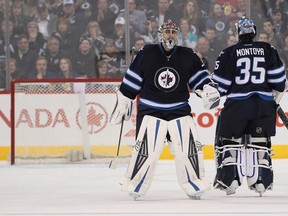 Ondrej Pavelec skates off the ice as he is replaced by Al Montoya against the Ottawa Senators earlier this month. Pavelec will be back in net tonight for the Jets. (Marianne Helm/Getty Images/AFP)