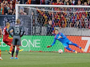 TFC goalkeeper Julio Cesar can't stop a penalty by Real Salt Lake's Alvaro Sabario on Saturday night. (USA TODAY SPORTS)