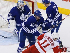 Maple Leafs forward Nazem Kadri lowers the boom on the Red Wings’ Daniel Alfredsson at the Air Canada Centre last night. (Stan Behal/Toronto Sun)