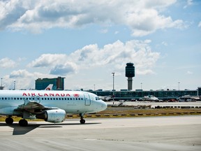 An Air Canada plane is pictured at Vancouver International Airport in Vancouver in this May 24, 2012 file photo. (CARMINE MARINELLI/QMI Agency)