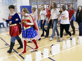 Donna Nixon and Candace O'Hara, cancer survivors, lead the first lap of the Relay for Life kickoff event in Belleville Saturday.  
Emily Mountney/The Intelligencer