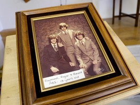 A photo of Belleville triplets Raymond, Roger, and Ronald Bowler is on display at their surprise 50th birthday celebration Saturday in Belleville. 
Emily Mountney/The Intelligencer/QMI Agency