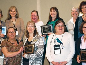 Sheila Smidt, front right, and Joanne Degroot, standing next to her, from the Carmangay Municipal Library, and Cheryl Cochlan, back right, and Jen Forhmzway standing next to her, from the Vulcan Municipal Library, recently received READ awards on behalf of their libraries from Chinook Arch.
Photo by Lauren Jessop