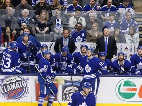 Maple Leafs players react during their 4-2 loss to the Detroit Red Wings on Saturday night. (Stan Behal/Toronto Sun)