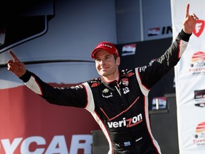 Will Power of Australia celebrates his victory in the Verizon IndyCar Series Firestone Grand Prix of St. Petersburg on Sunday.  (Chris Trotman/Getty Images/AFP)