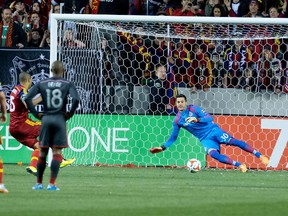 Real Salt Lake forward Alvaro Saborio scores past Toronto FC goalkeeper Julio Cesar on a penalty during Saturday night’s game. (USA TODAY SPORTS)