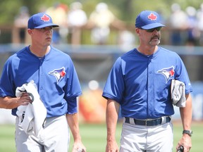Pitching coach Pete Walker, talking with young hurler Aaron Sanchez, breaks down the strengths and weaknesses of the five-man Jays rotation. (Veronica Henri, Toronto Sun)